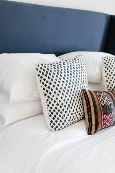 A guest bedroom makeover with Brooklinen sheets, making luxury affordable.